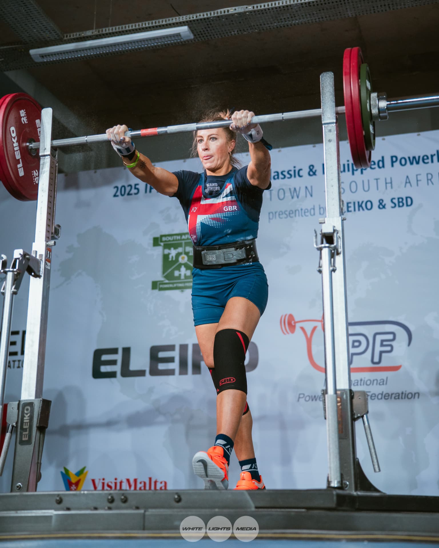 Carole O'Neil competing at an international powerlifting championship