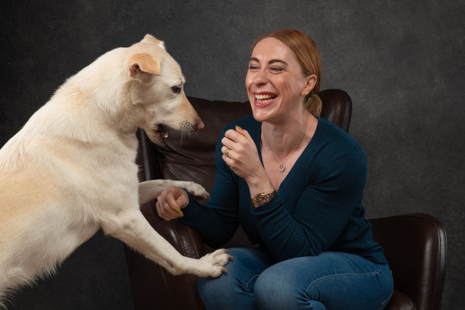 Carole laughing with her dog