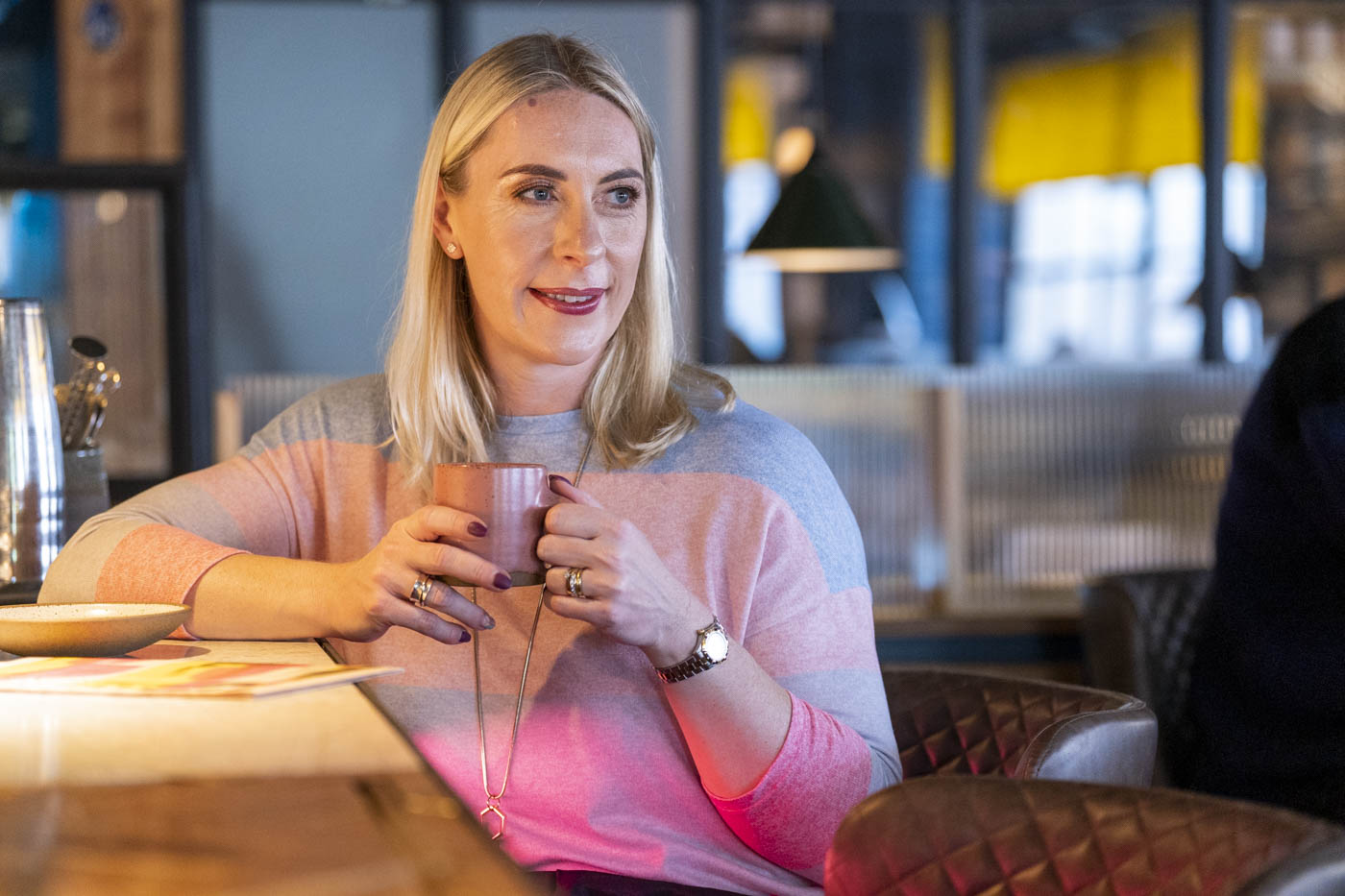 Carole O'Neil in conversation over coffee
